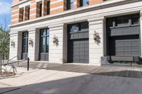 a building with a wooden floor and two gray doors with brown trims that look to be front