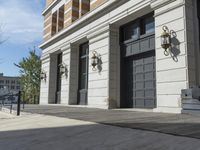 a building with a wooden floor and two gray doors with brown trims that look to be front