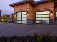 two modern wooden garages in a home setting at twilight in northern california, usa