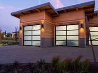 two modern wooden garages in a home setting at twilight in northern california, usa