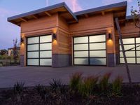 two modern wooden garages in a home setting at twilight in northern california, usa