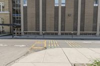 a sidewalk that has a building on top of it and no one in front with a fire hydrant on top of the sidewalk