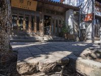 there is a very old fashioned building with steps and a street sign that reads shanghai