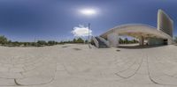 a man is seen in this fisheye panoramic shot of a pedestrian walkway