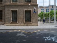 the side walk and walkway of a building is marked with markings for parking spaces below