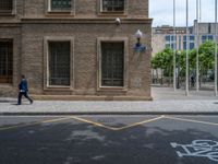 the side walk and walkway of a building is marked with markings for parking spaces below