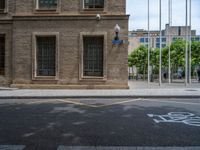 the side walk and walkway of a building is marked with markings for parking spaces below