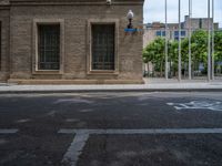 the side walk and walkway of a building is marked with markings for parking spaces below