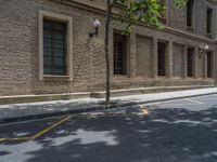 the side walk and walkway of a building is marked with markings for parking spaces below