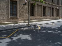 the side walk and walkway of a building is marked with markings for parking spaces below