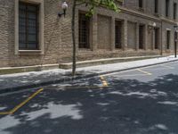 the side walk and walkway of a building is marked with markings for parking spaces below