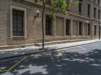 the side walk and walkway of a building is marked with markings for parking spaces below