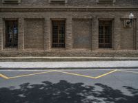 the side walk and walkway of a building is marked with markings for parking spaces below