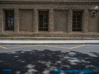 the side walk and walkway of a building is marked with markings for parking spaces below