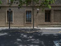 the side walk and walkway of a building is marked with markings for parking spaces below