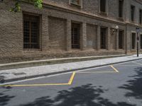 the side walk and walkway of a building is marked with markings for parking spaces below