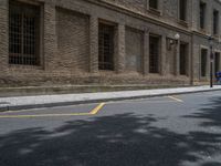 the side walk and walkway of a building is marked with markings for parking spaces below