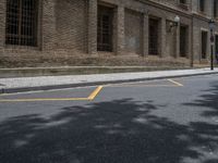 the side walk and walkway of a building is marked with markings for parking spaces below