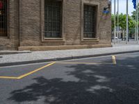 the side walk and walkway of a building is marked with markings for parking spaces below