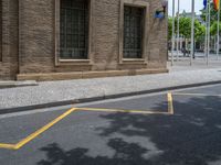 the side walk and walkway of a building is marked with markings for parking spaces below