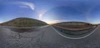 a large open road with the sky reflected on it's reflective surface from below