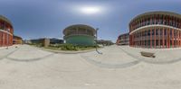 a fish eye lens shows the outside of an office building on the other side of the road