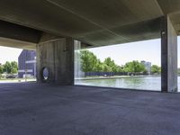 an outdoor structure of cement and concrete with a large water feature in the front corner