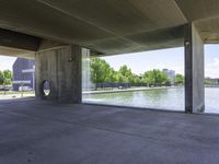 an outdoor structure of cement and concrete with a large water feature in the front corner