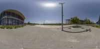 a fish eye view of an industrial area that is built on one side and has multiple buildings