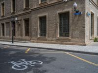 the side walk and walkway of a building is marked with markings for parking spaces below