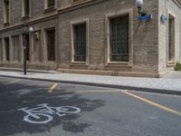 the side walk and walkway of a building is marked with markings for parking spaces below