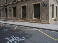 the side walk and walkway of a building is marked with markings for parking spaces below