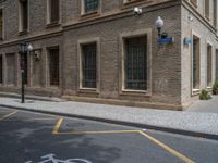 the side walk and walkway of a building is marked with markings for parking spaces below