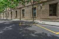 the side walk and walkway of a building is marked with markings for parking spaces below