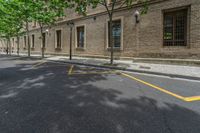 the side walk and walkway of a building is marked with markings for parking spaces below