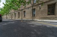 the side walk and walkway of a building is marked with markings for parking spaces below