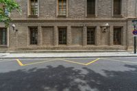 the side walk and walkway of a building is marked with markings for parking spaces below