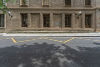 the side walk and walkway of a building is marked with markings for parking spaces below