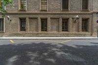 the side walk and walkway of a building is marked with markings for parking spaces below