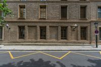 the side walk and walkway of a building is marked with markings for parking spaces below