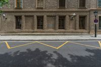 the side walk and walkway of a building is marked with markings for parking spaces below