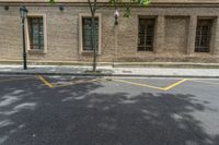 the side walk and walkway of a building is marked with markings for parking spaces below