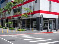 a crosswalk in the street with red and white painted on the outside of it