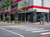 a crosswalk in the street with red and white painted on the outside of it