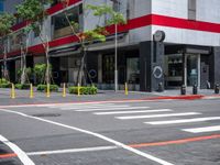 a crosswalk in the street with red and white painted on the outside of it