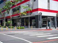 a crosswalk in the street with red and white painted on the outside of it