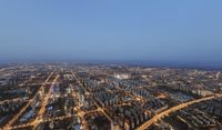 the view of the city in the evening from the highest point of the tower of tallest building