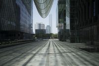 a man walking down a city street surrounded by tall buildings and trees under an overcast sky