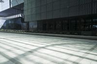 an open building with some lights on the side and windows in it that are empty