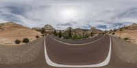 a road is seen in this 360 - ray shot with its wide angle and angled perspective